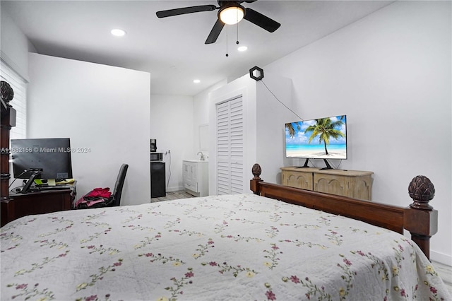 bedroom featuring sink and ceiling fan