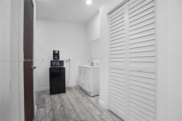 bathroom with vanity and wood-type flooring