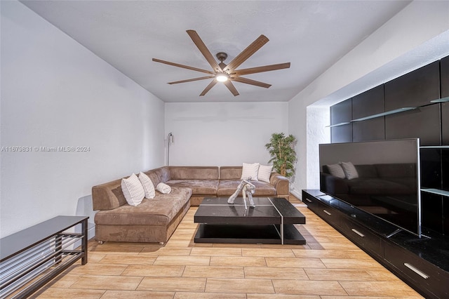 living room featuring light wood-type flooring and ceiling fan