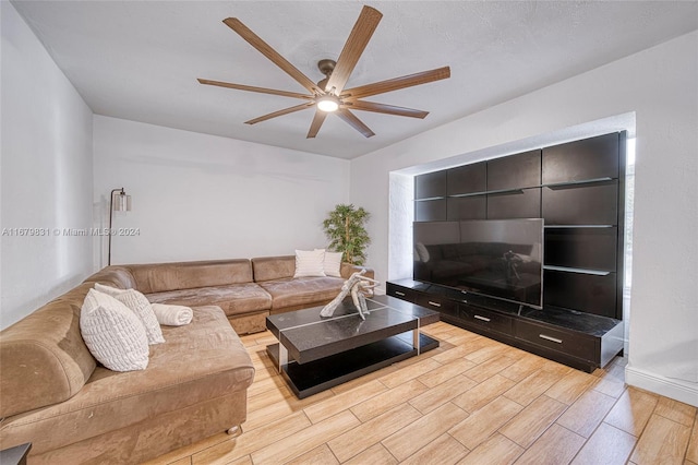 living room featuring light wood-type flooring and ceiling fan