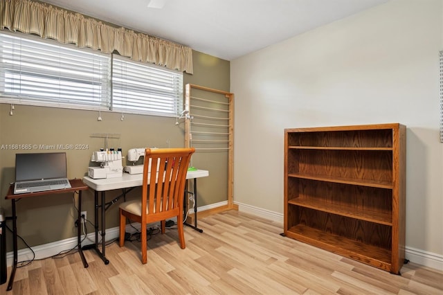 office with light hardwood / wood-style floors