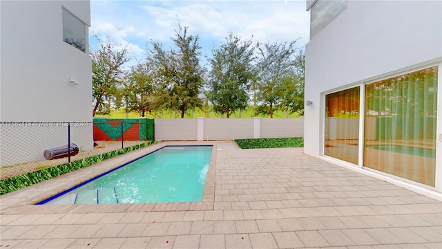 view of swimming pool featuring a patio