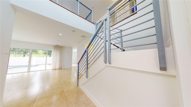 stairway featuring tile patterned floors