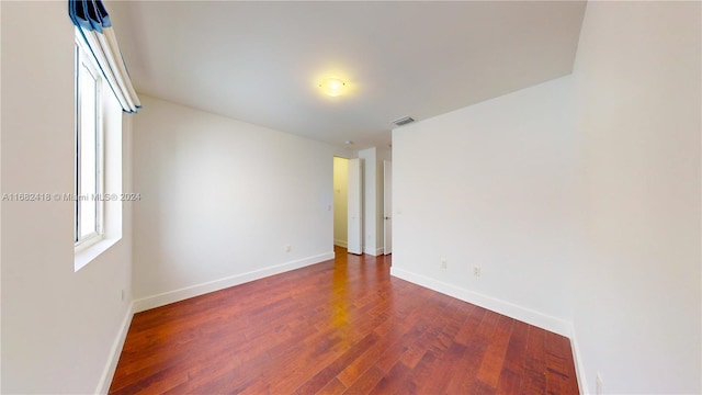 empty room featuring dark hardwood / wood-style floors