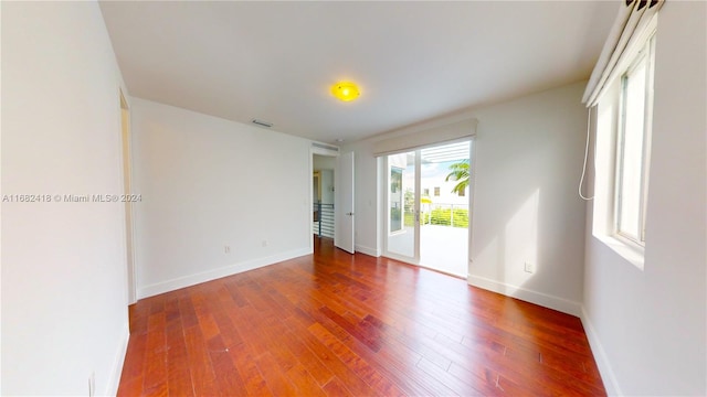 empty room with wood-type flooring