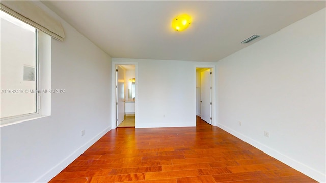 empty room featuring hardwood / wood-style flooring