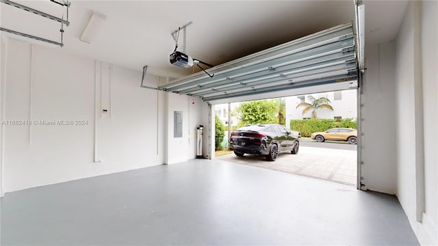 garage featuring a garage door opener and electric panel