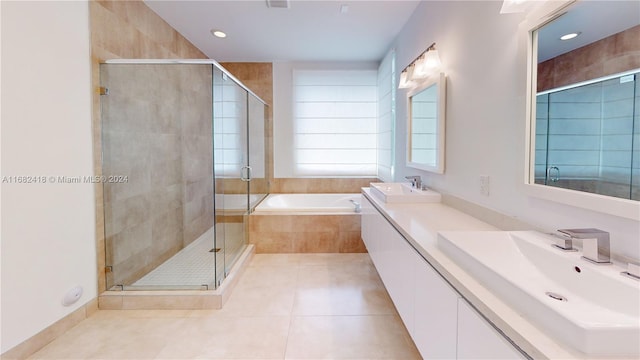 bathroom featuring vanity, tile patterned floors, and separate shower and tub