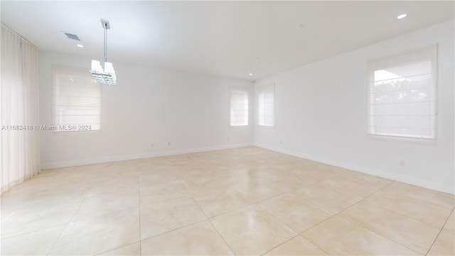 spare room with light tile patterned floors