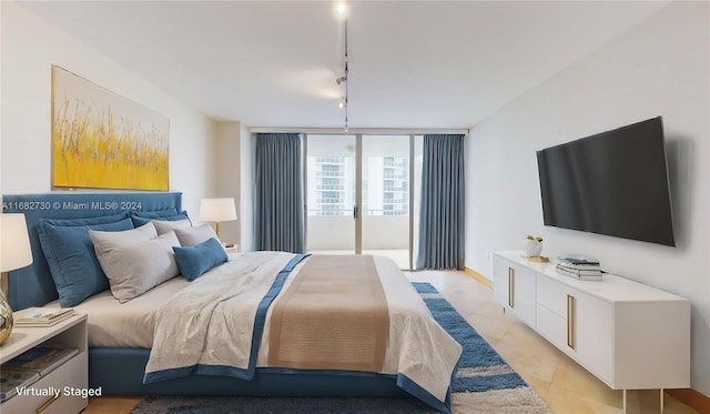 bedroom with rail lighting and floor to ceiling windows