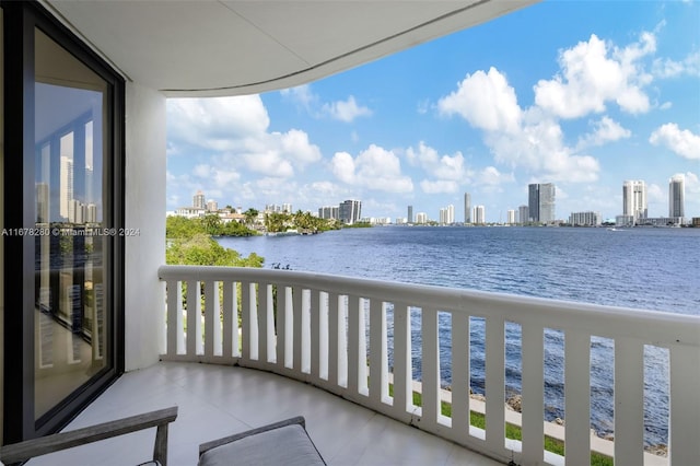 balcony featuring a water view