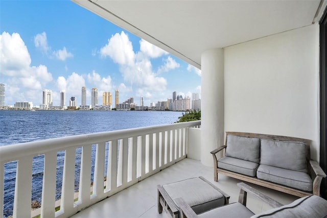 balcony featuring a water view