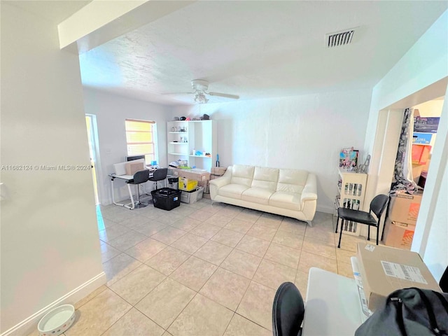 tiled living room featuring ceiling fan