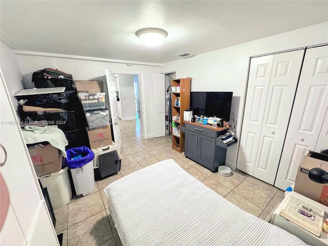 62 NW 73rd Pl, Miami, FL 33126 - bedroom featuring light tile patterned floors and a closet