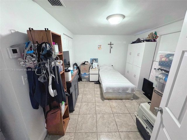 bedroom with light tile patterned flooring