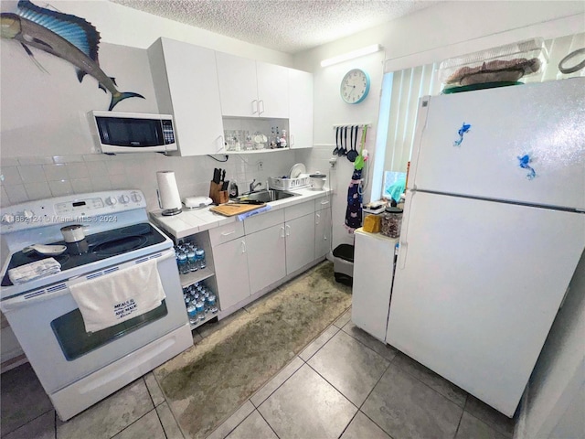 62 NW 73rd Pl, Miami, FL 33126 - kitchen featuring white appliances, decorative backsplash, a textured ceiling, light tile patterned flooring, and open shelves