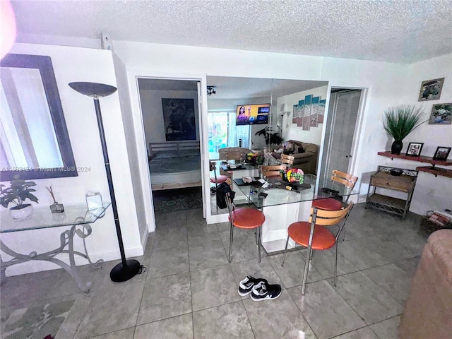 dining area with a textured ceiling