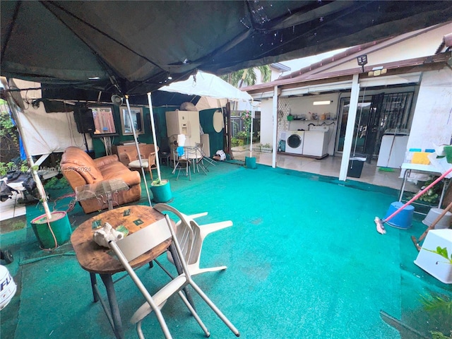 basement with washer and clothes dryer