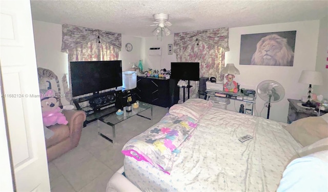 bedroom with a textured ceiling and ceiling fan