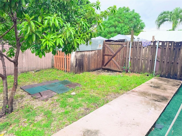 62 NW 73rd Pl, Miami, FL 33126 - fenced backyard with a gate