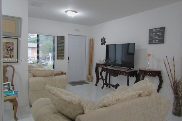 living room with light tile patterned floors