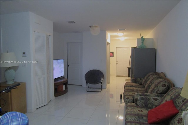 living room featuring light tile patterned floors