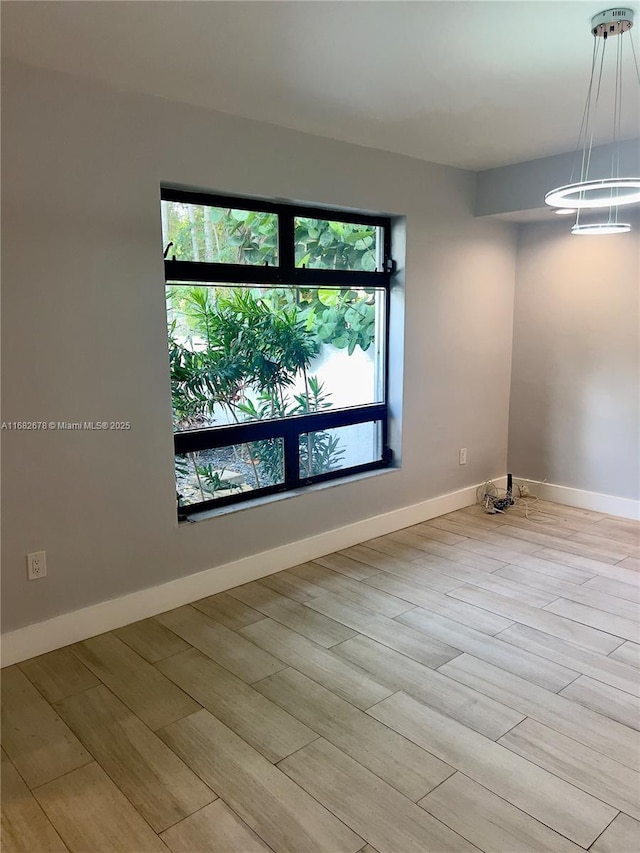 spare room featuring light wood-type flooring