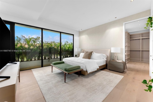 650 Warren Ln, Key Biscayne, FL 33149 - bedroom featuring light wood-type flooring and recessed lighting