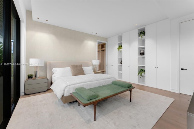 650 Warren Ln, Key Biscayne, FL 33149 - bedroom featuring two closets and wood finished floors