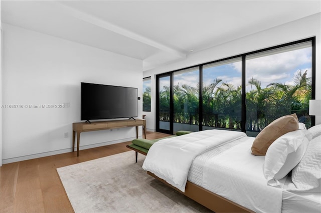650 Warren Ln, Key Biscayne, FL 33149 - bedroom featuring access to exterior and wood finished floors