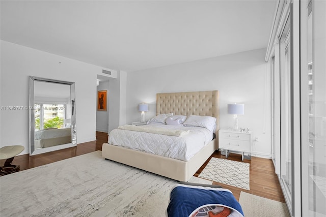 bedroom featuring hardwood / wood-style floors