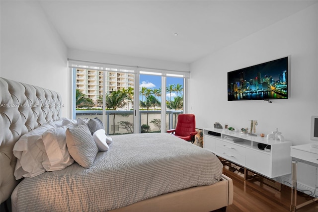 bedroom with hardwood / wood-style flooring