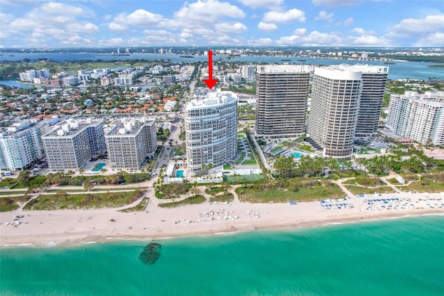 bird's eye view with a water view and a view of the beach