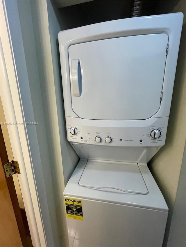 laundry area featuring stacked washer / dryer