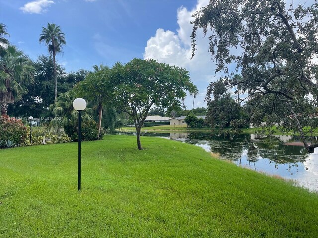 11453 NW 39th Ct Unit 308-2, Coral Springs, FL 33065 - view of yard with a water view