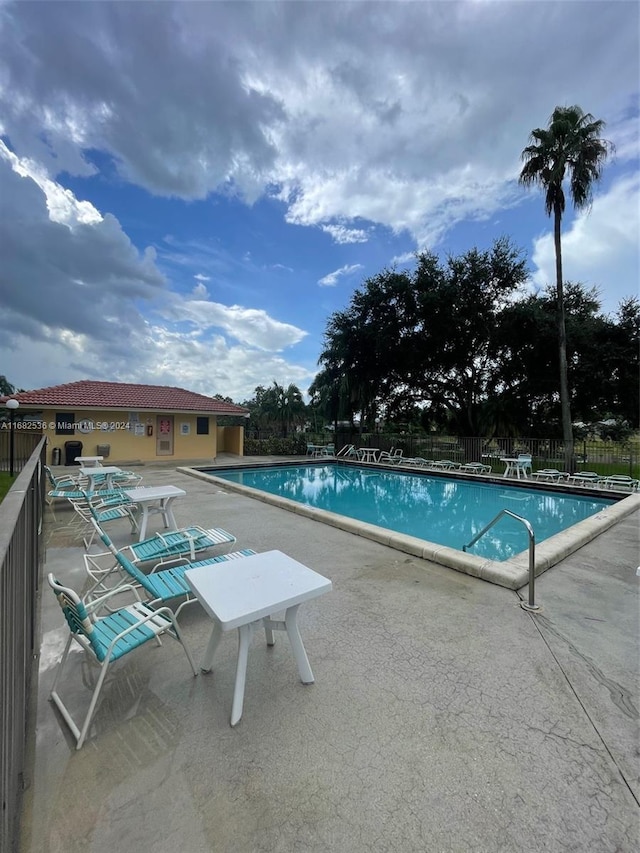 view of swimming pool featuring a patio area