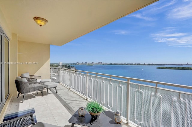 balcony featuring a water view