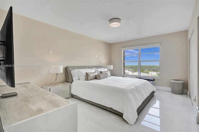 bedroom with light tile patterned flooring