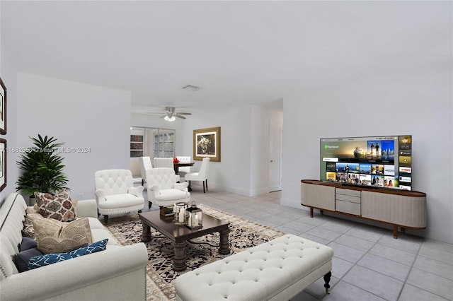 living room with light tile patterned floors and ceiling fan