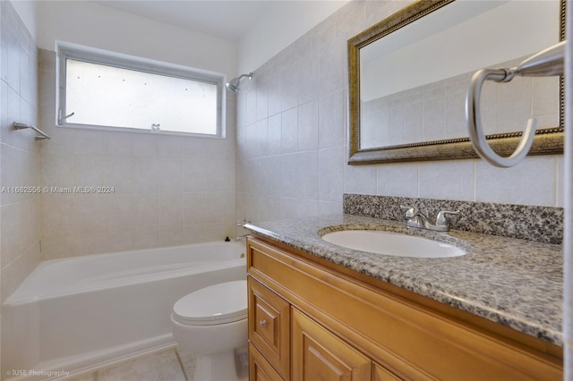 full bathroom with vanity, toilet, tile patterned floors, and tiled shower / bath