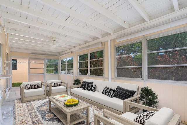 sunroom featuring wood ceiling, beamed ceiling, and ceiling fan