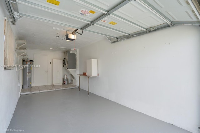 garage featuring a garage door opener and electric water heater