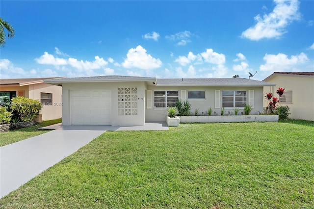 ranch-style house with a front yard and a garage