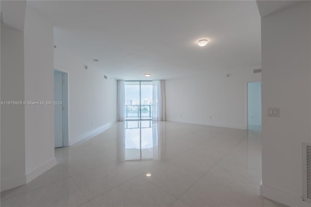 spare room featuring light tile patterned floors