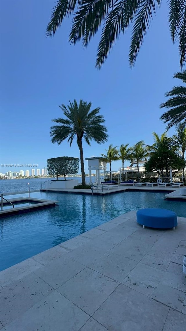 view of pool featuring a water view