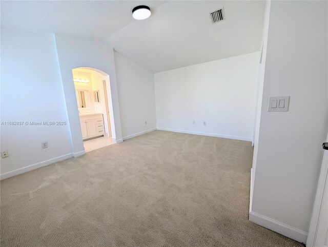 bathroom with a tile shower, tile patterned floors, vanity, and toilet