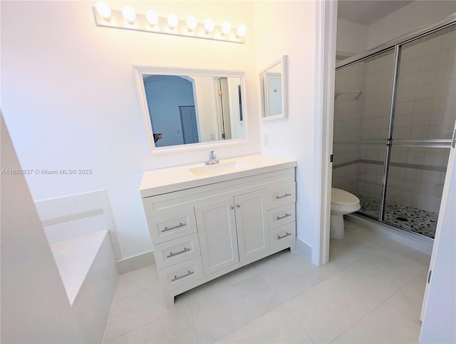 full bath with tile patterned flooring, a stall shower, toilet, and vanity