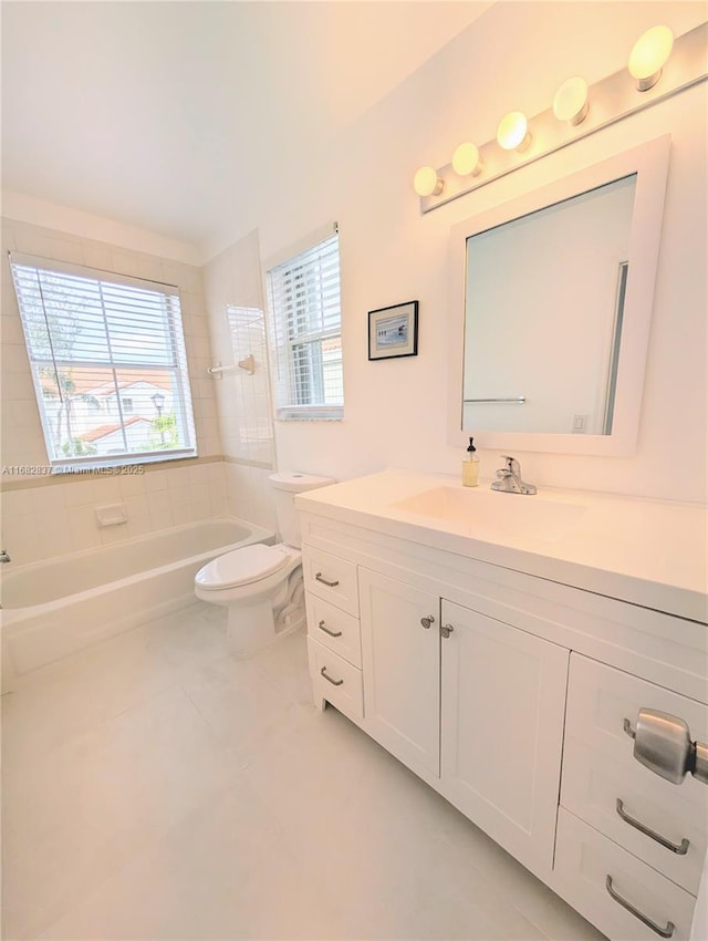 full bath with tile patterned floors, toilet, a healthy amount of sunlight, and vanity