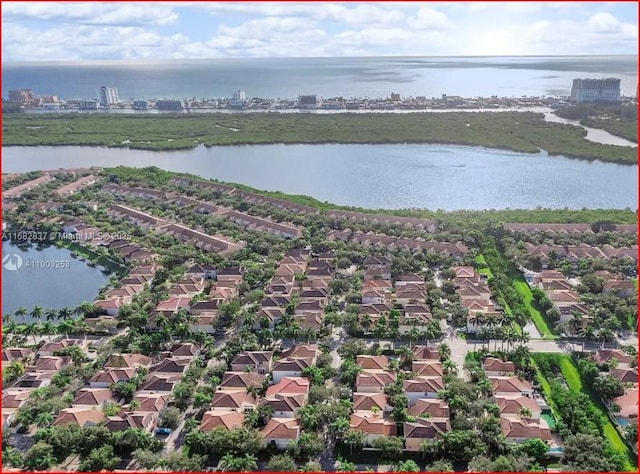 bird's eye view with a residential view and a water view