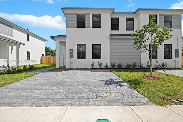 view of front of home with a front lawn